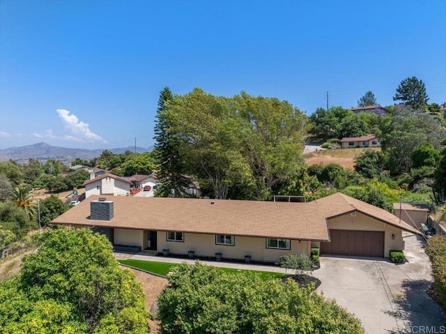 ranch-style house featuring a mountain view and a garage