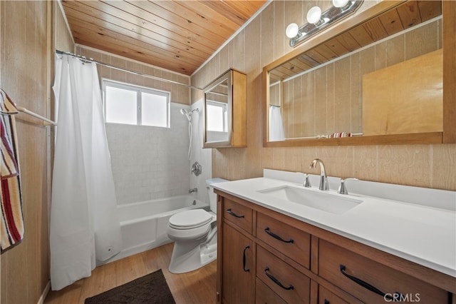 full bathroom featuring wooden ceiling, wood-type flooring, toilet, shower / bath combo, and vanity