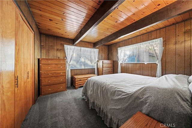 bedroom with carpet flooring, wood walls, beamed ceiling, and wooden ceiling