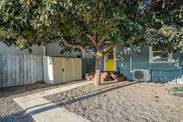 exterior space with a storage unit and ac unit