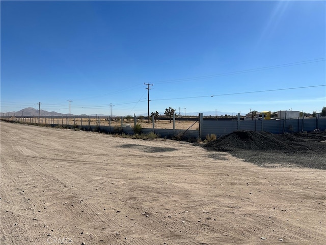 view of yard with a rural view