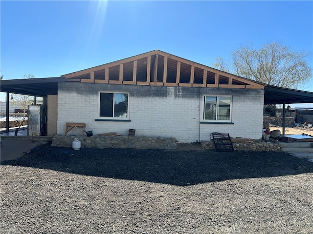 view of property exterior featuring a carport