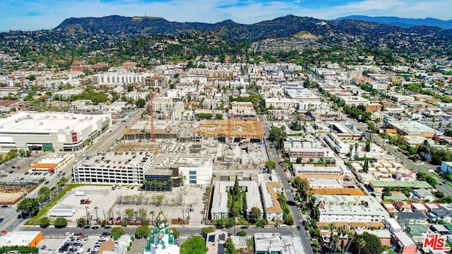 birds eye view of property featuring a mountain view