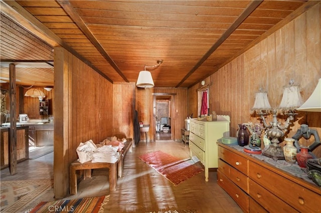 interior space featuring wood walls and wooden ceiling