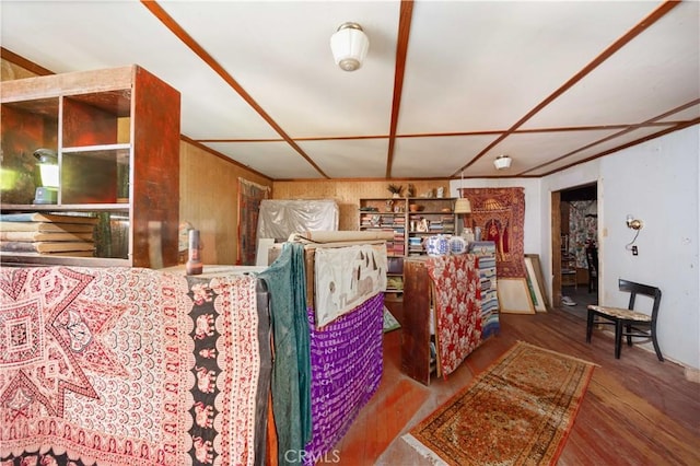 interior space featuring wood walls and hardwood / wood-style floors