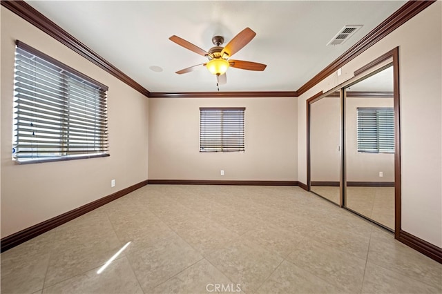 unfurnished bedroom with a closet, ceiling fan, and ornamental molding