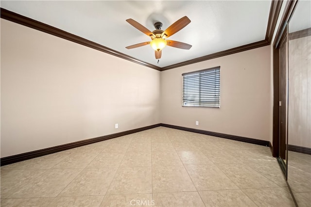 spare room with ceiling fan and crown molding