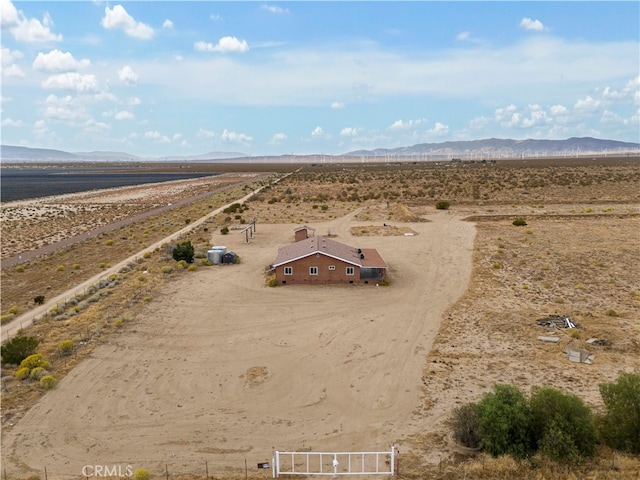 birds eye view of property featuring a mountain view and a rural view