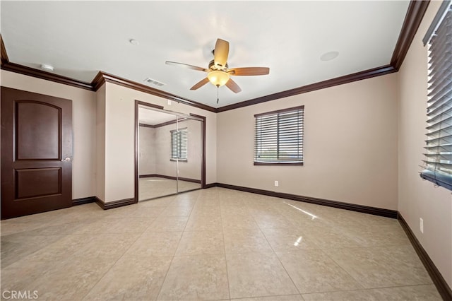 unfurnished bedroom featuring ornamental molding, a closet, and ceiling fan