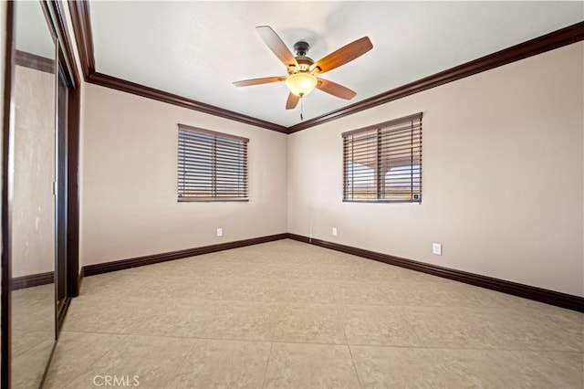 spare room with ceiling fan and ornamental molding