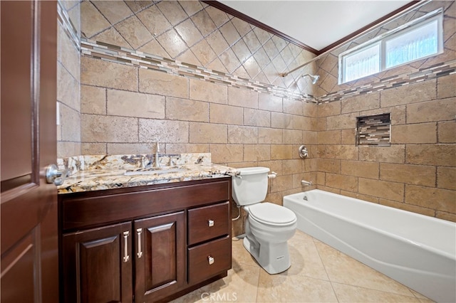 full bathroom featuring toilet, tiled shower / bath, crown molding, tile walls, and vanity