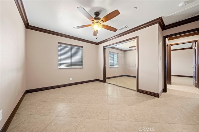 unfurnished bedroom featuring a closet, ceiling fan, and ornamental molding