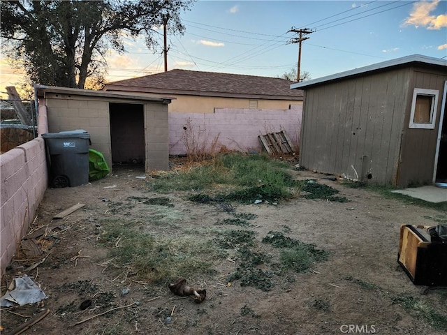 exterior space featuring a shed