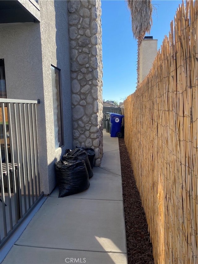 view of property exterior with a patio