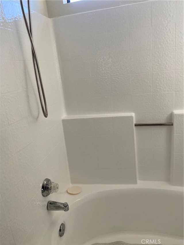 bathroom with shower / bath combination