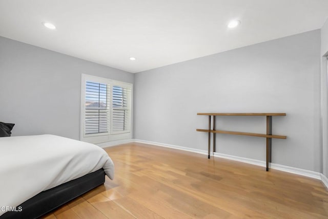 bedroom with wood-type flooring