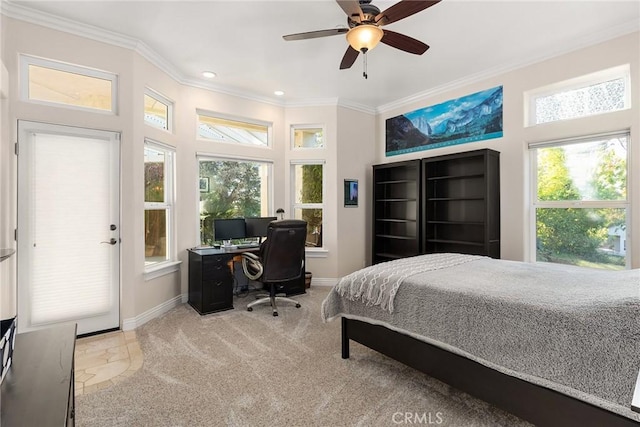 carpeted bedroom featuring ceiling fan, multiple windows, and crown molding