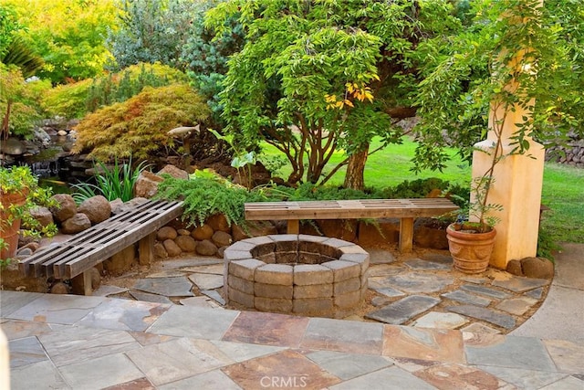 view of patio featuring an outdoor fire pit