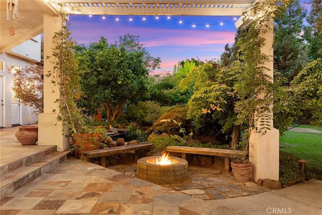 patio terrace at dusk with a fire pit