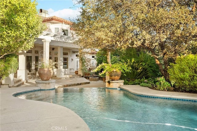 view of pool featuring a pergola and a patio