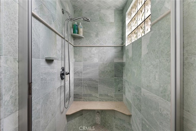 bathroom with tiled shower