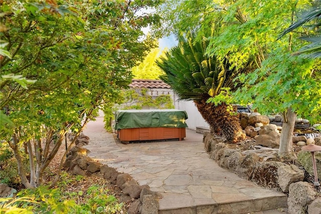 view of patio / terrace featuring a hot tub