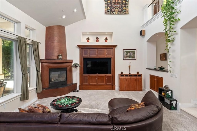 carpeted living room with a fireplace