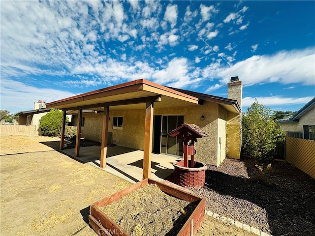 rear view of house featuring a patio area