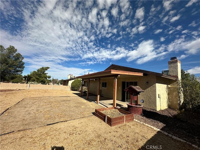 rear view of house with a patio