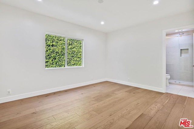 unfurnished room featuring light wood-type flooring