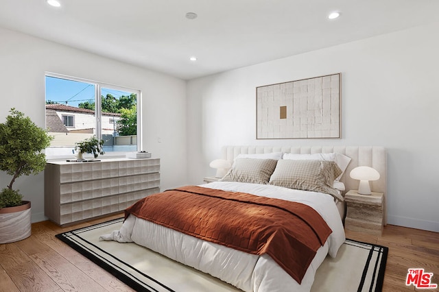 bedroom featuring wood-type flooring