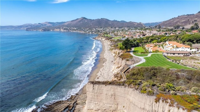 aerial view featuring a water and mountain view