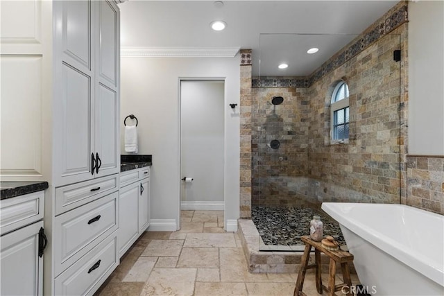 bathroom featuring vanity, shower with separate bathtub, and ornamental molding