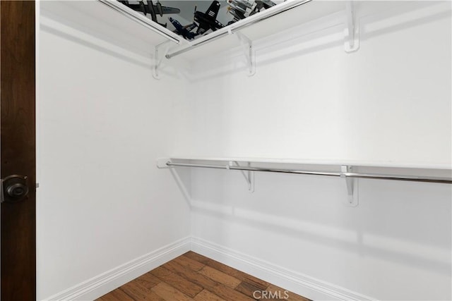 spacious closet with wood finished floors