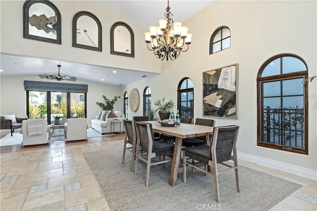 dining area with an inviting chandelier and high vaulted ceiling