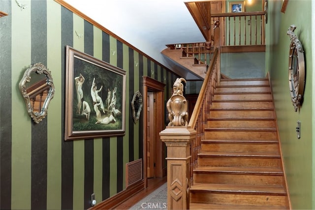 stairway featuring wood-type flooring