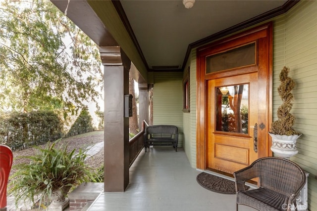 property entrance with covered porch