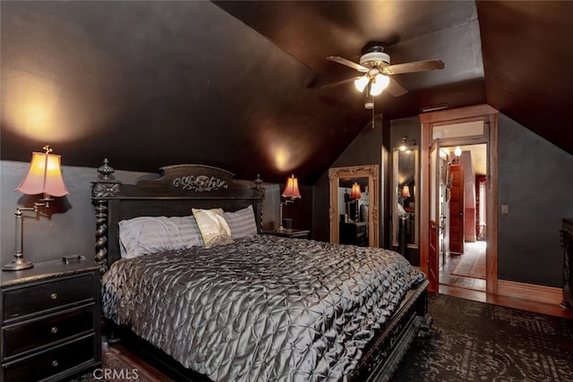 bedroom featuring ceiling fan, dark hardwood / wood-style floors, and vaulted ceiling