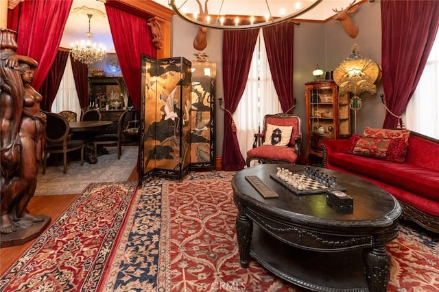 living area featuring an inviting chandelier