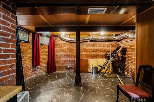 basement with brick wall