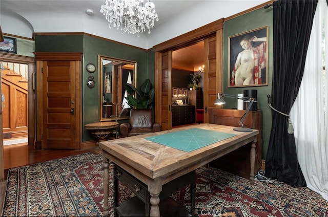 game room featuring hardwood / wood-style floors and a chandelier