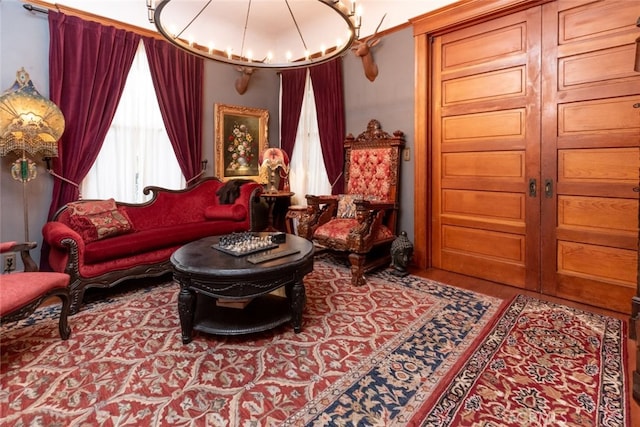 living area featuring a chandelier