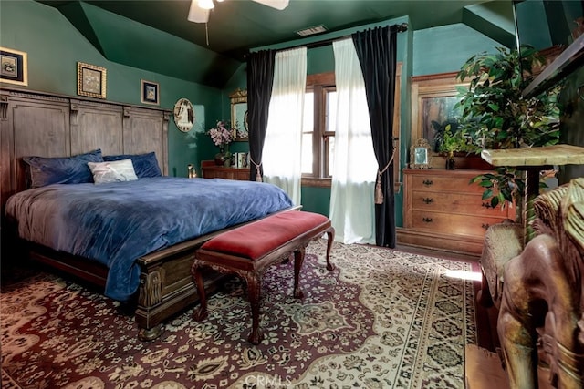 bedroom with ceiling fan, light hardwood / wood-style floors, and lofted ceiling