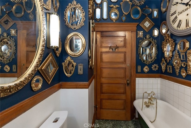 bathroom with a bathtub and toilet