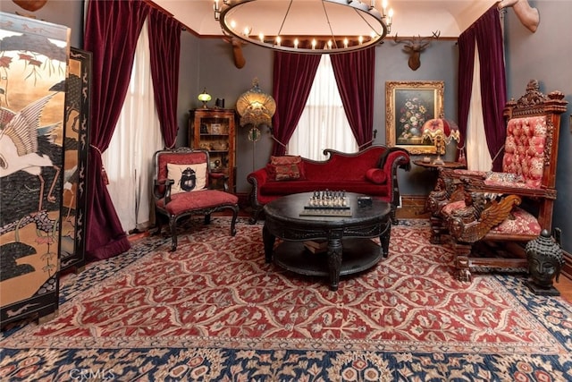 sitting room with an inviting chandelier