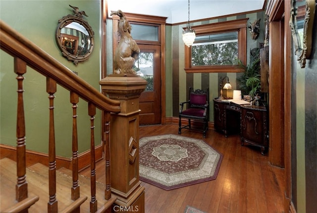 interior space with hardwood / wood-style floors and ornamental molding