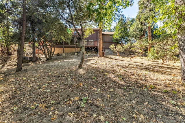 view of yard with a wooden deck