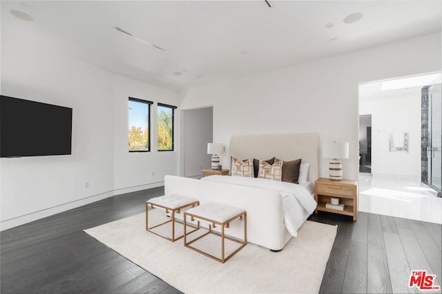 bedroom featuring dark hardwood / wood-style flooring