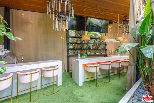 bar with wood ceiling and carpet floors