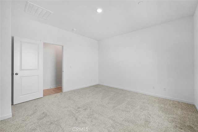 empty room featuring light colored carpet